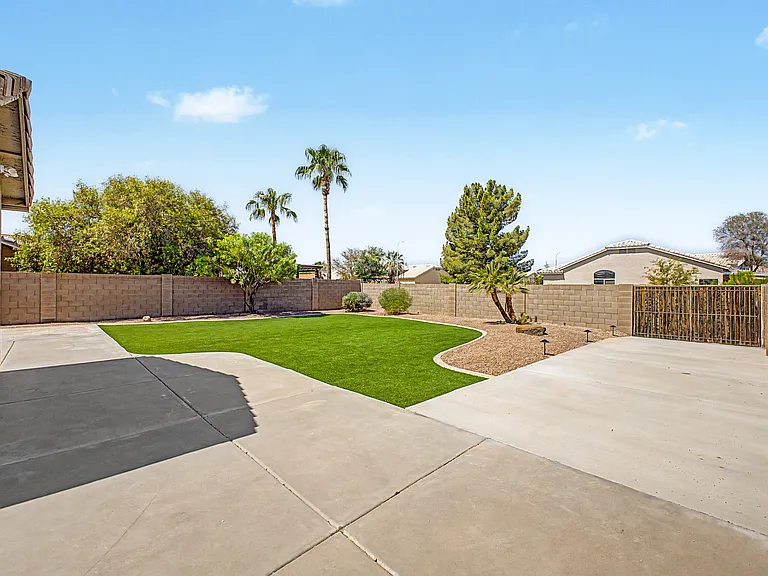 Newly landscaped with turf and oversized RV parking.
