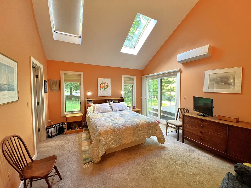 Main level bedroom with queen bed and private bath