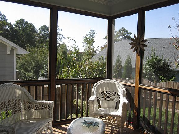 Sip your favorite brew in the screened porch overlooking the private yard.