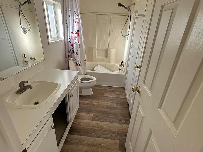 Primary Bathroom with garden tub and linens closet.