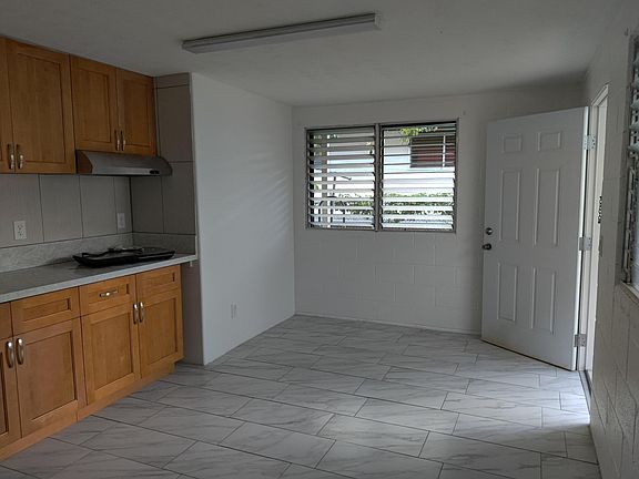 New unit with ceramic tiles throughout.