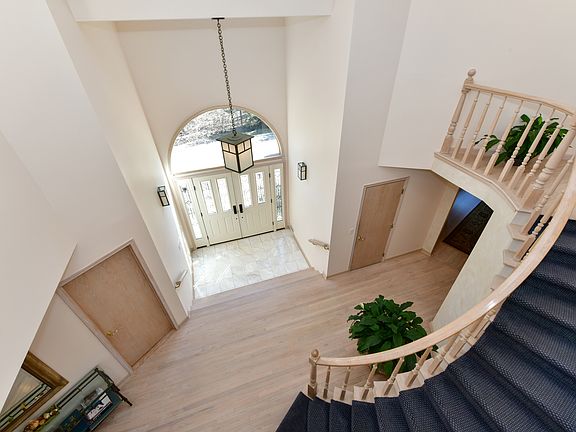 Two Story Entry Curved Staircase