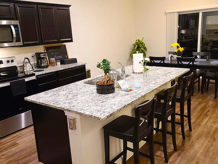 kitchen island with three counter height chairs