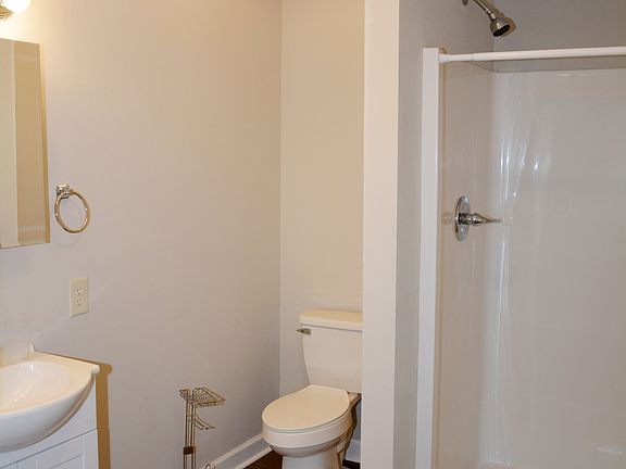 Bathroom with walk-in shower.
