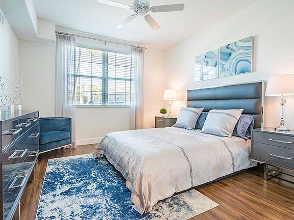 Bedroom with hard surface flooring and ceiling fan