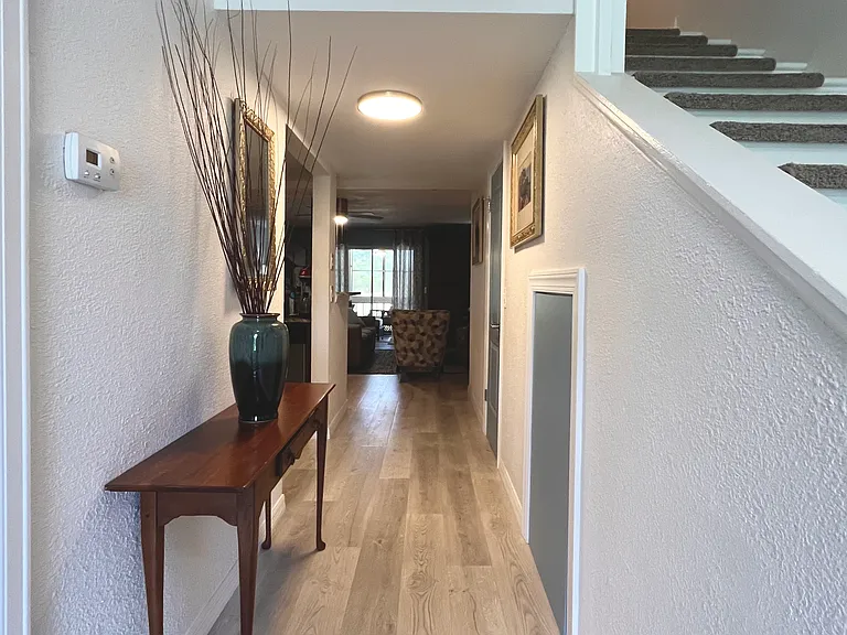 Open foyer with Dining Room to the left and stairs to 2nd Story to the right.