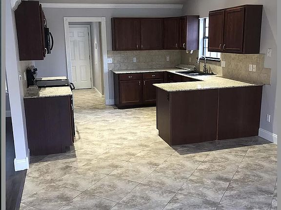 Open large kitchen with granite countertops and lots of cabinet space