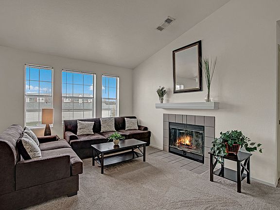 St. James Place Fireplace with Couches, Fireplace, and Window