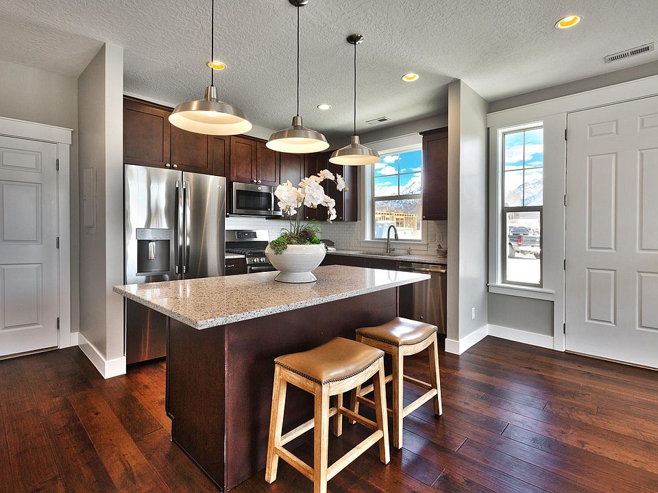 Modern, clean, warm kitchen space.