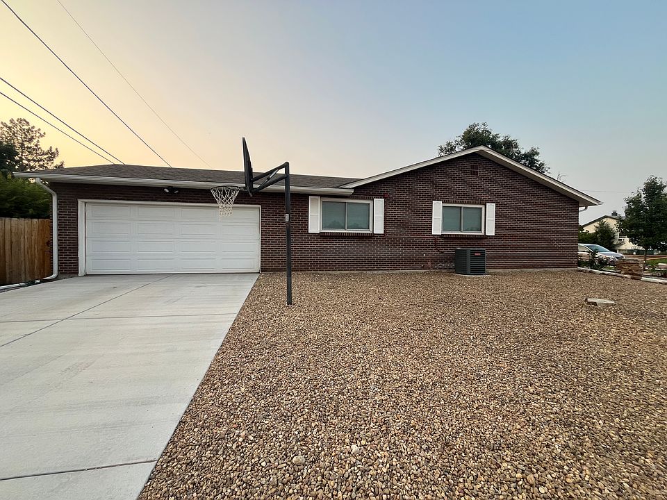 Large 2-car garage with basketball hoop and freshly poured concrete driveway and sidewalks (the wide ones!)