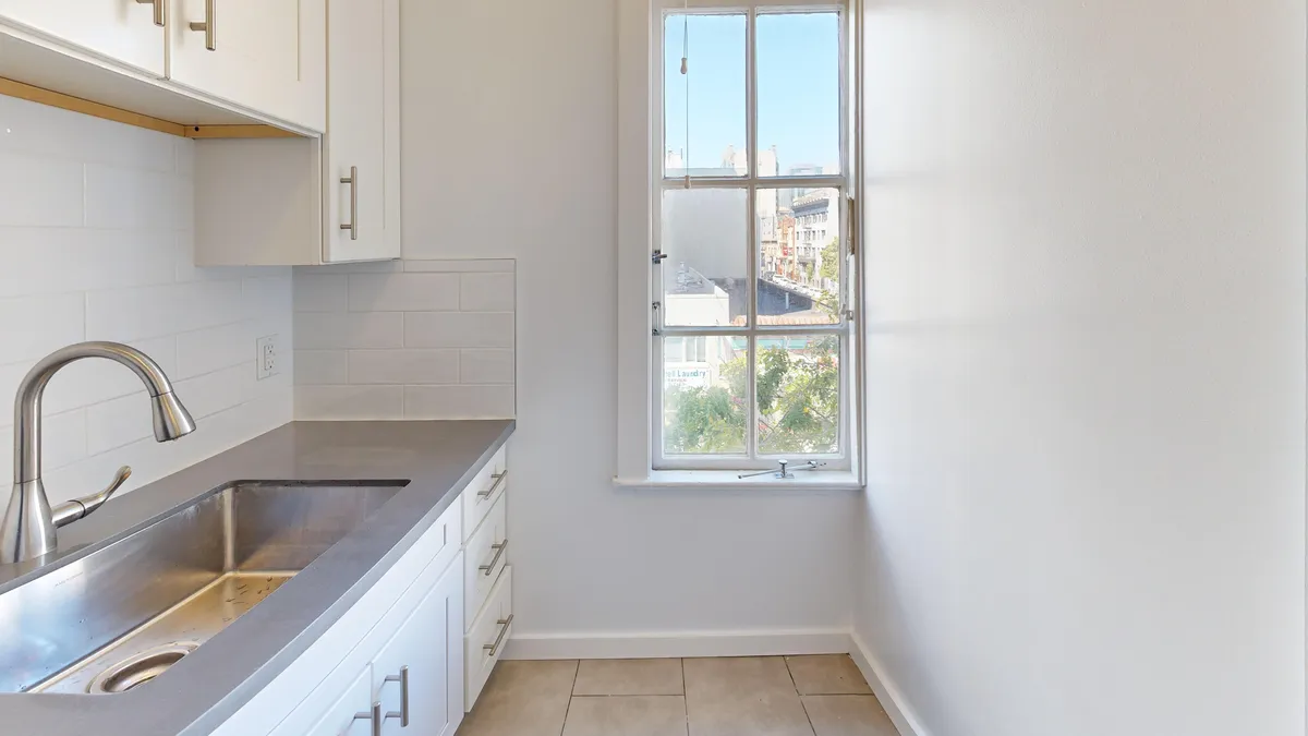 Kitchen with cabinets and sink - 691 O'Farrell Street