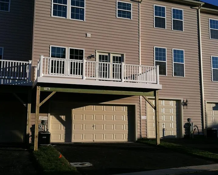 Rear entry garage has two spaces in the garage and room for two more cars on the driveway.