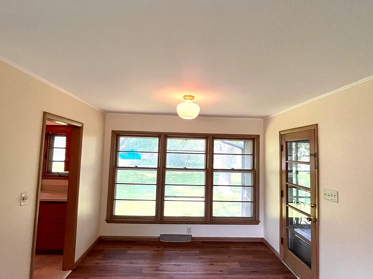 View from front window, kitchen to the left and patio to the right.