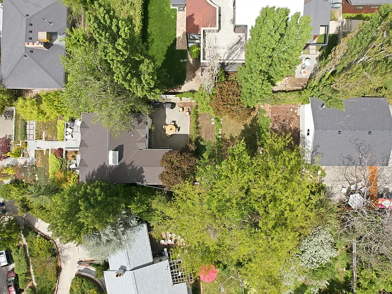 The home is set on a large 0.22 acre lot. Private garden with mature trees and access from both street and alley for convenient parking.
