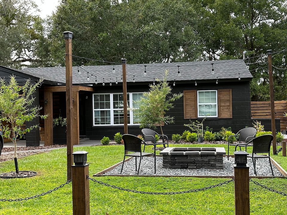 The most unique exterior feature is this FRONT YARD FIRE PIT LOUNGE area. It offers ambient cafe string lighting as well as seating area for special gatherings with friends or family!