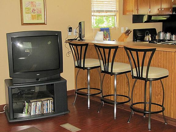 Breakfast bar into kitchen. Is open to living area.