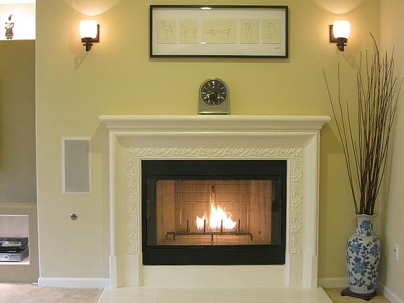 Open living room floor plan to adjoining chef's kitchen. Built-in entertainment center with in-wall/in-ceiling surround sound speakers. Gas fireplace.