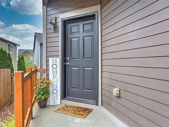 Stylish black front door and newer handrail welcomes you and your guests.