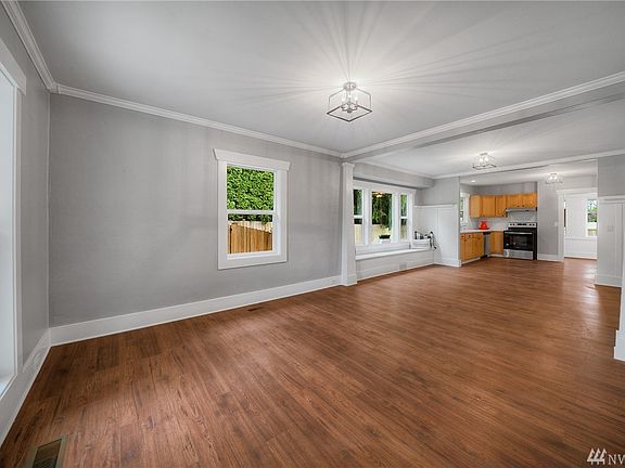 Look at those wood-wrapped windows and generous baseboards. 
