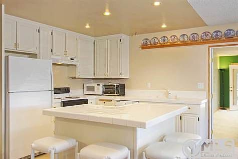 Nicely laid out kitchen. Counter eating area which accommodates 4 bar stools. Possible desk area in one corner.