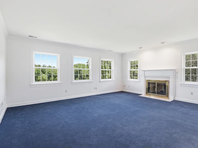 Upper level primary suite with private fireplace.