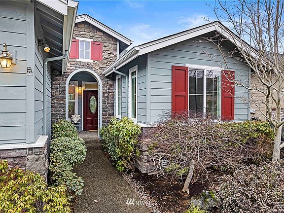 Stroll up to your covered front porch~Front yard maintenance covered by HOA