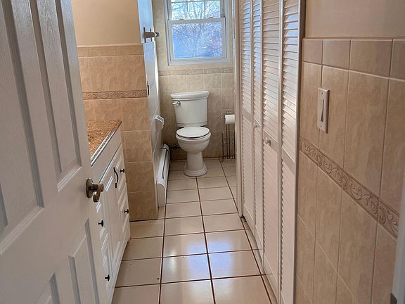 Bathroom with washer and dryer included