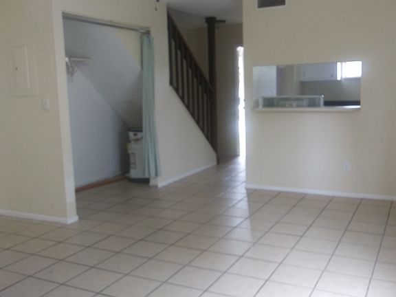 Breakfast bar pass thru over the stove and the laundry hookups are in the under the stairs closet.