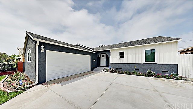 Everything in picture is brand new, roof, driveway, windows, landscaping, garage door, fencing