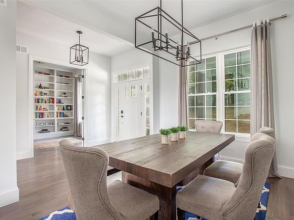 Formal dining area is visible from the foyer