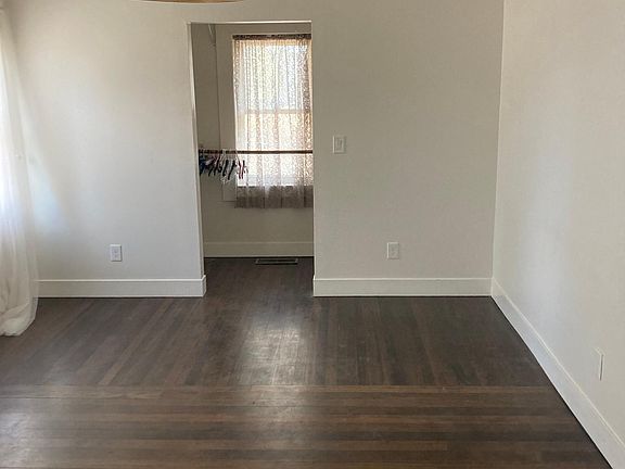 Master bedroom with area for a desk and a walk-in closet.