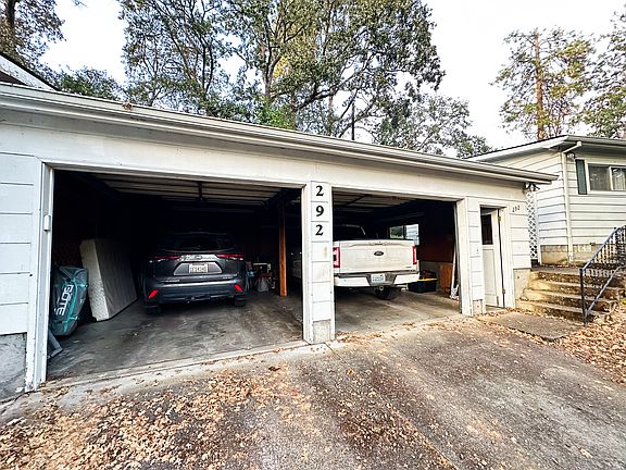 Set just below the main house, the oversized two-car garage rests on a gentle rise _ making access easy in every season. The pull-through driveway offers extra parking and an effortless flow that's rare in hillside homes.