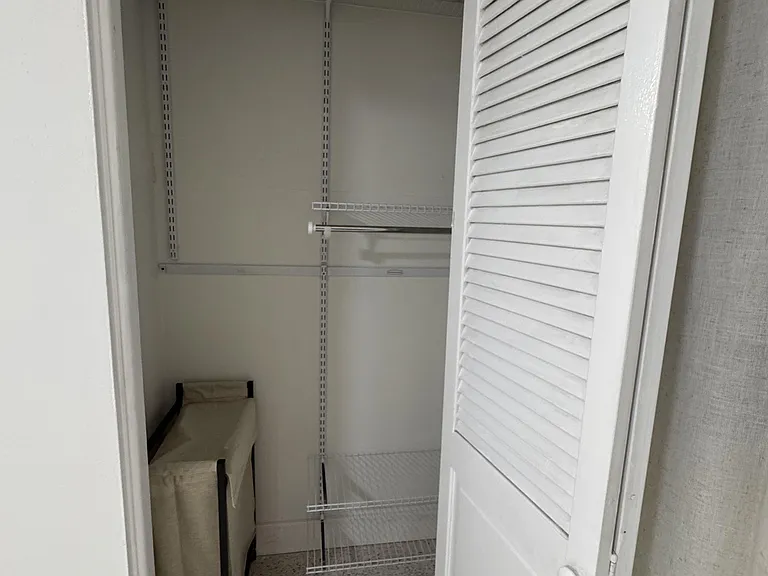 Two Closets with lights and shelves