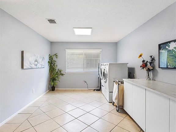 Sellers relocated washer and dryer connections inside to dining room, but can be relocated back to garage.