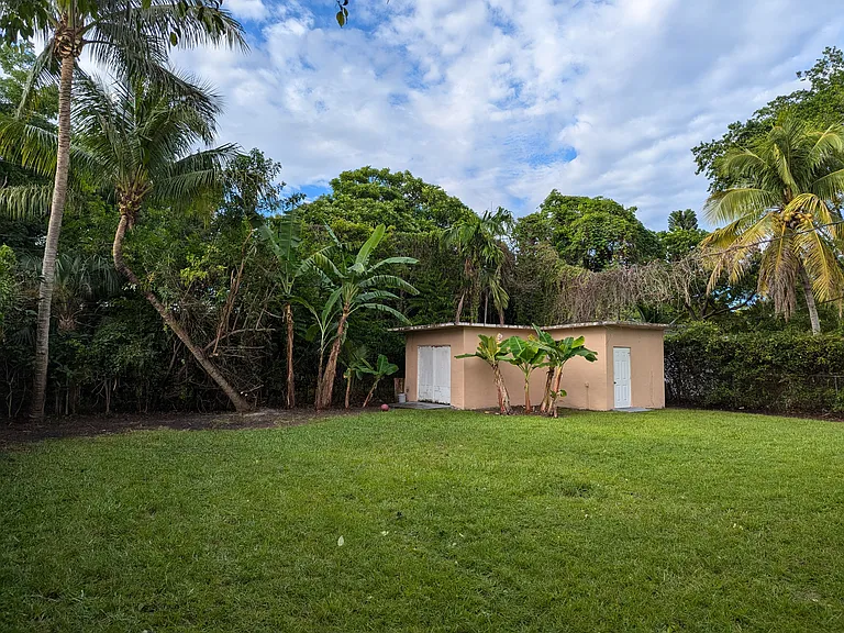 Two varieties of bananas and coconut palms. Air conditioned and powered garage or workspace.
