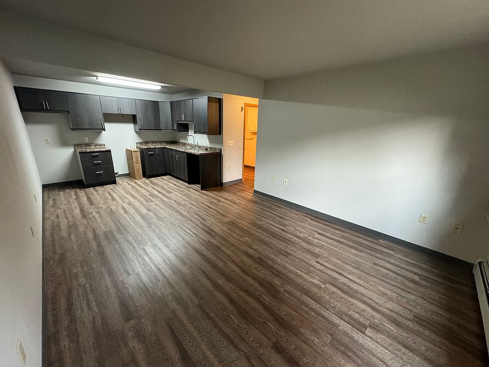 From entry door. Open concept kitchen, dining, and living room.