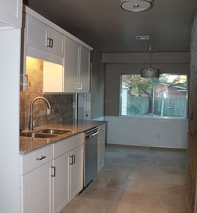 Kitchen
						:
						New soft close cabinets, granite counter, travertine floor, stainless steel appl