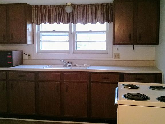 kitchen with mircowave, stove and fridge