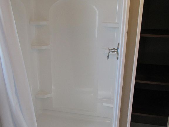 Master bath shower, and storage area shelves