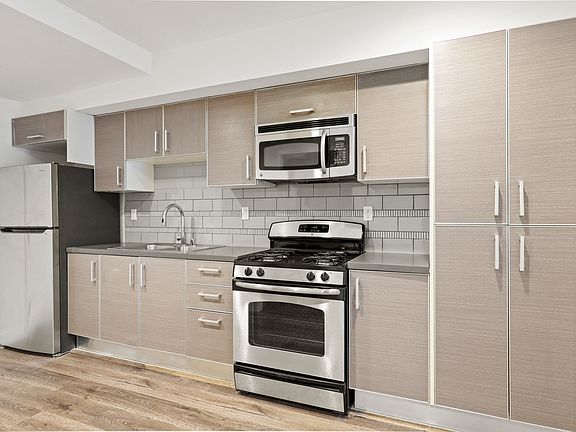 Kitchen with Stainless Steel Appliances and Ample Cabinet Storage