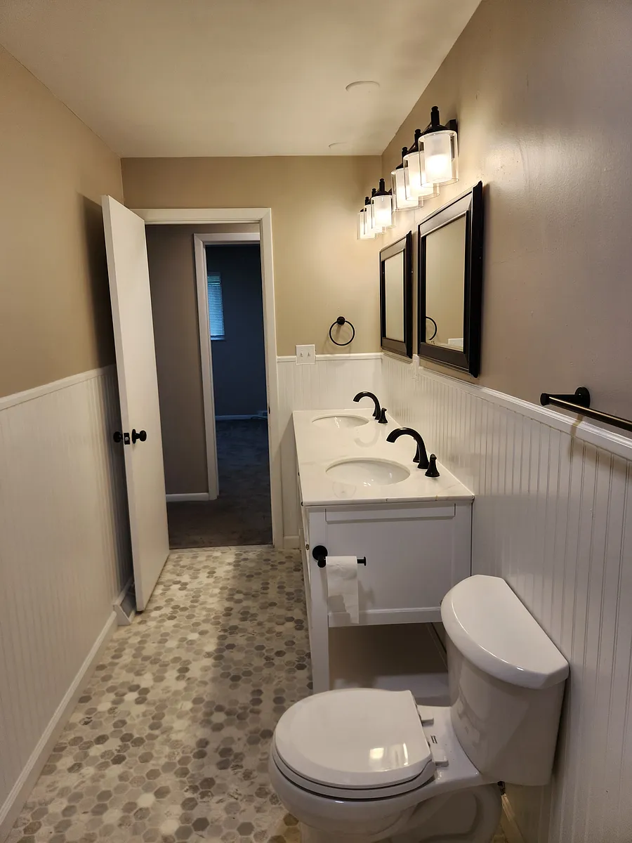 FULLY Rehabbed NEW Bathroom. New Flooring, Paint, NEW Double/Dual Vanity Sink and cabinet, dual framed mirrors, dual light fixtures/faucets, new bathroom hardware, New Toilet, New Tub/surround, New exhaust fan, Wainscoting, etc. - 12118 Center Ave #UPPER