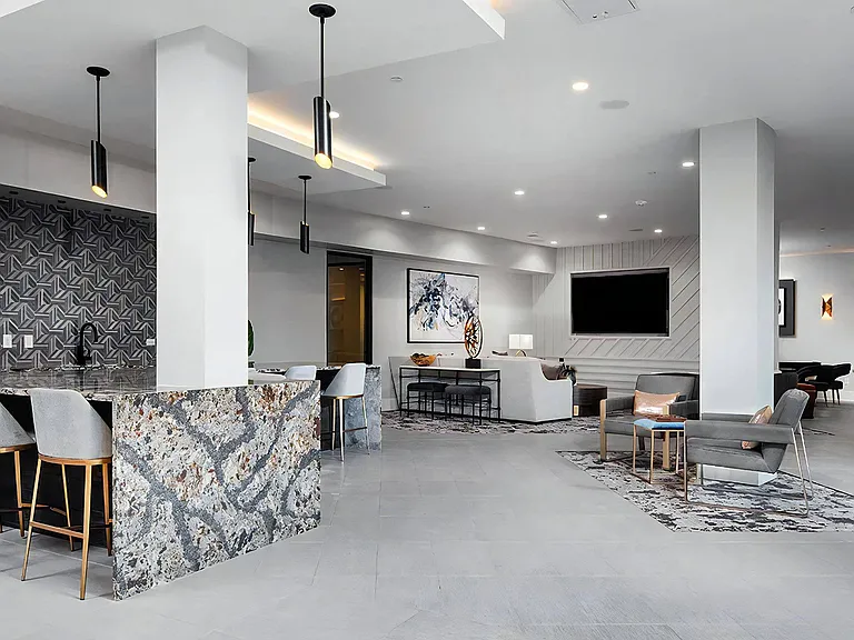 Multi-Use Community Lounge with Game Tables and Bar Area
