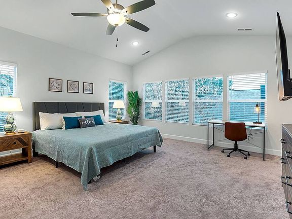 Oversized main bedroom perfect for relaxing or working.