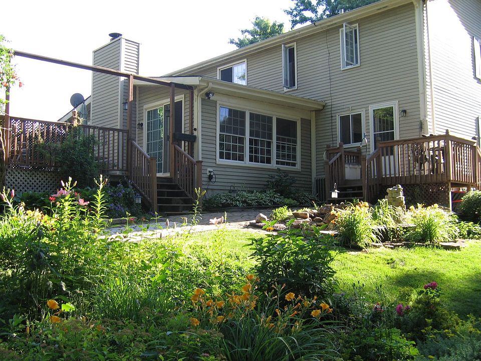 Three walls of windows in FR over looking yard