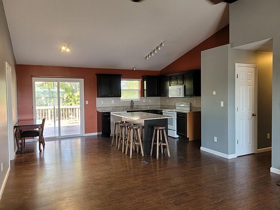 Kitchen with granite counter tops that walks out to the large deck.