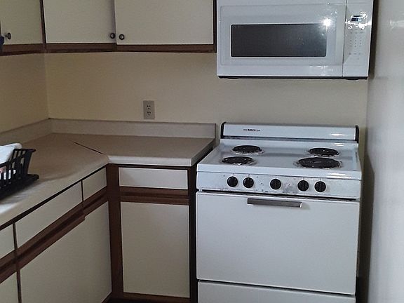 Kitchen. Range has been replaced with electric glass top range/oven with air fryer settings.
