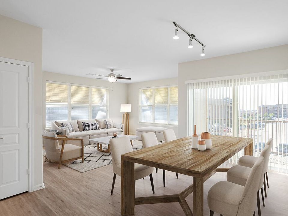 Dining and living room with hard surface vinyl plank flooring