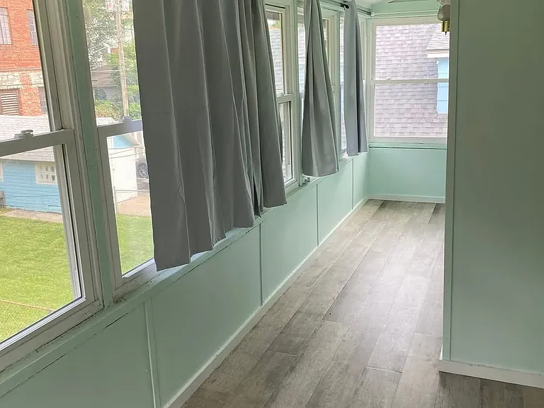 Newly renovated sun porch with brand-new windows and outlets. Perfect for a work space or mini greenhouse!
