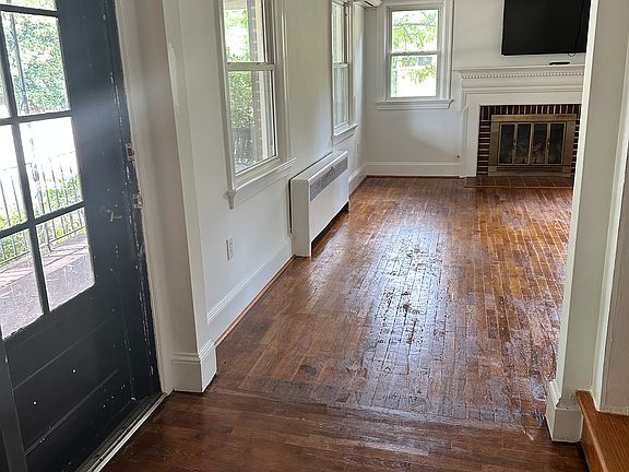 First bedroom looking out into the foyer and living room