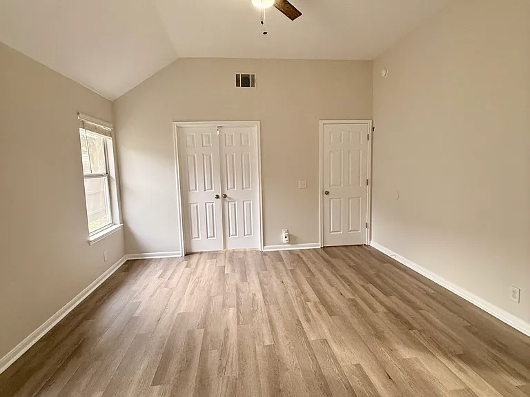 Master bedroom - view from master bath. French doors into second bedroom/ office/ nursery.